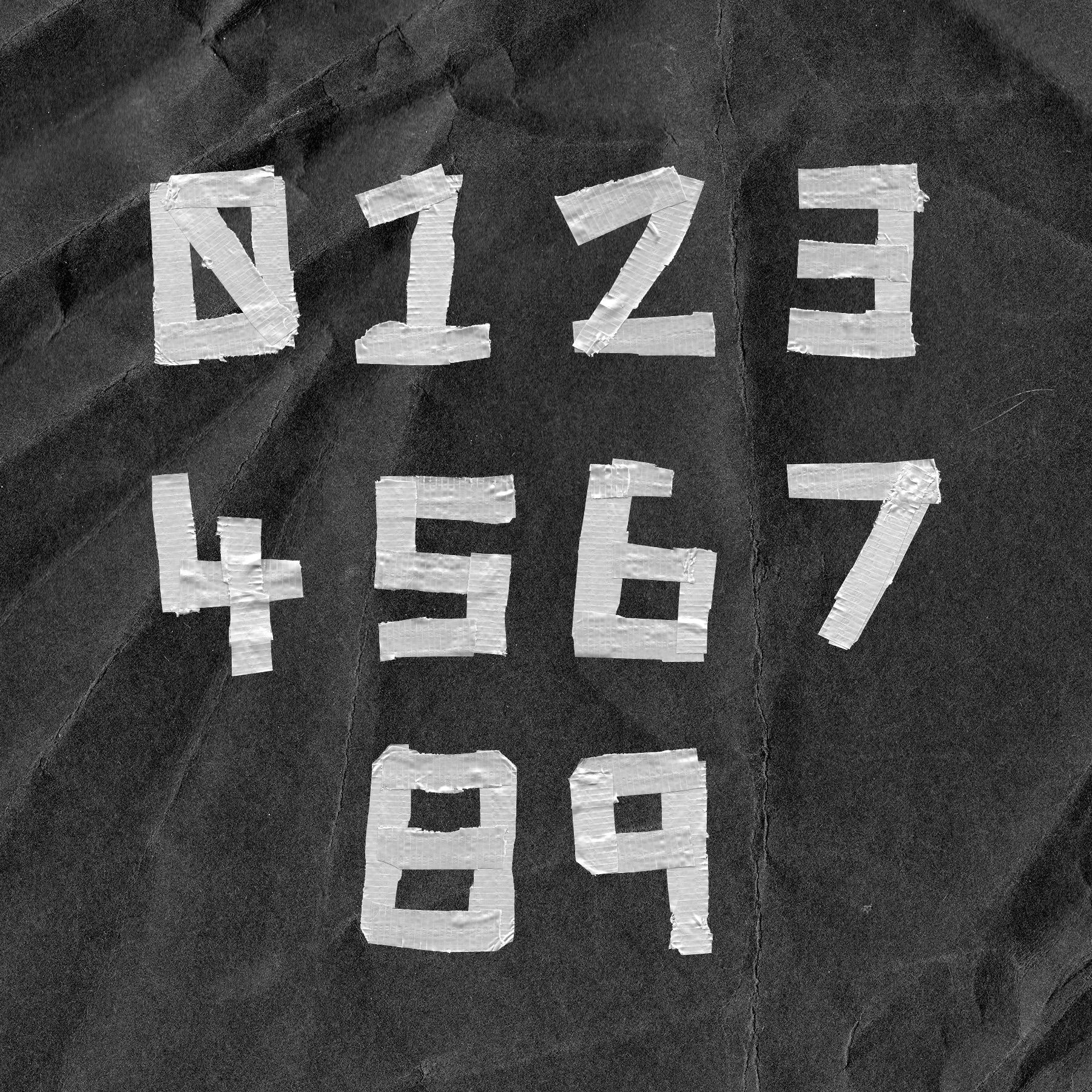 Text made out of duct tape on a textured background that reads "0123456789".